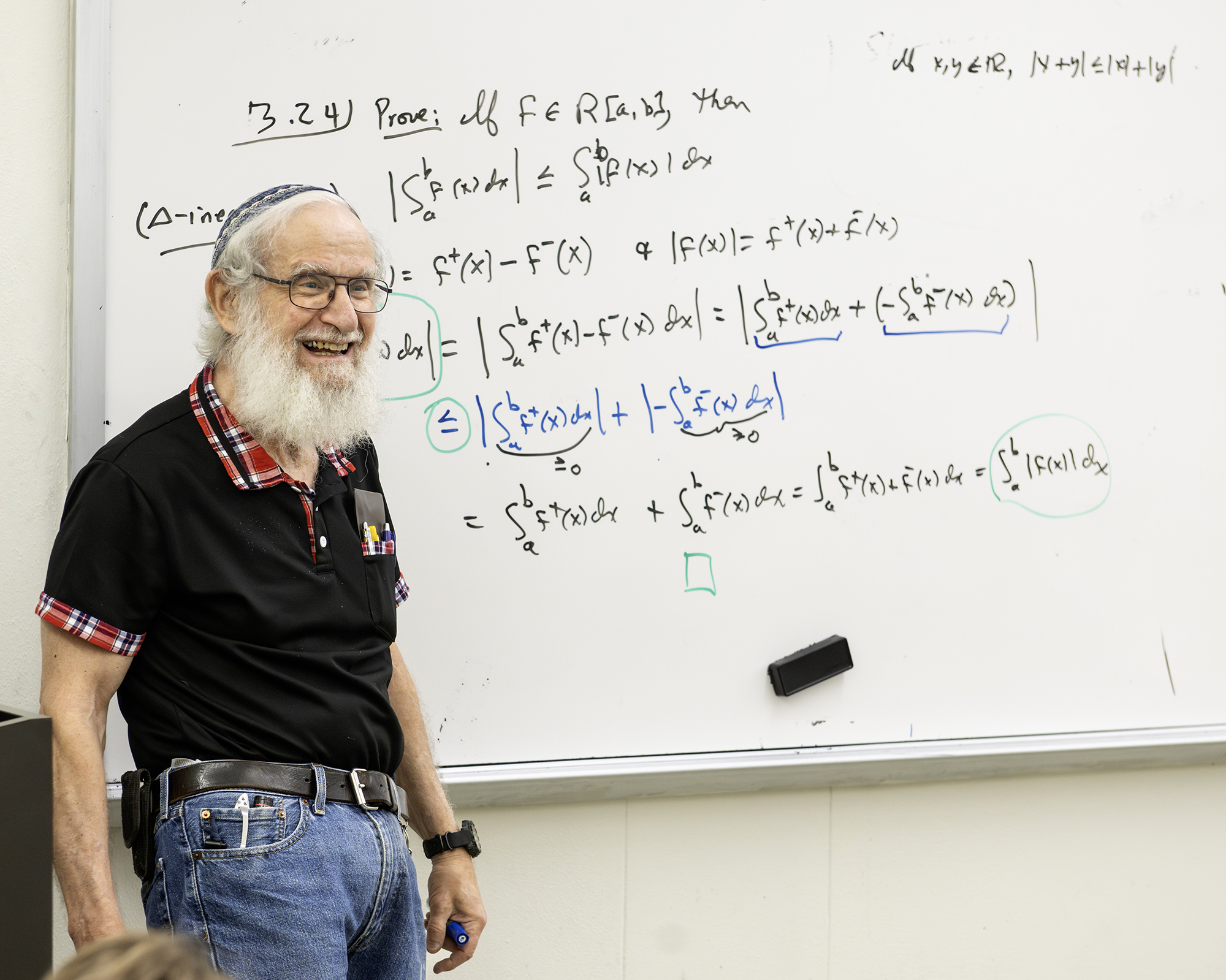 Dr. Leonard Richardson at the front of his classroom