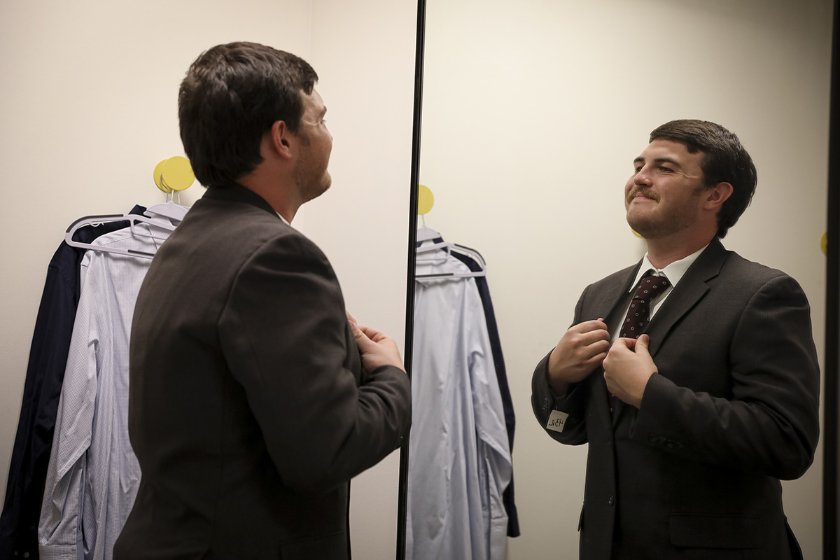 An LSU student tries on clothing