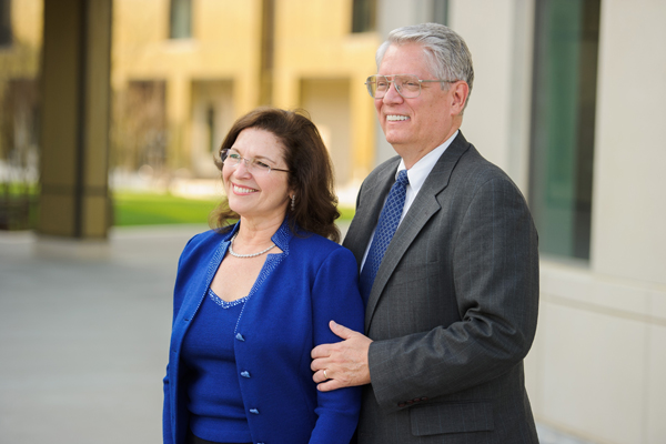 Emmett and Toni Stephenson smile for photo in front of BEC rotunda