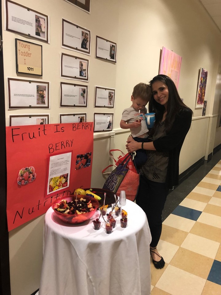 A mother holding her son at the event.