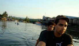 Prosanta and colleague in a boat on a river