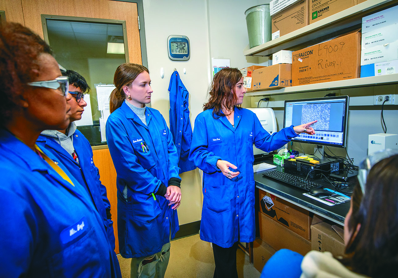 Famima Rivas with students in lab