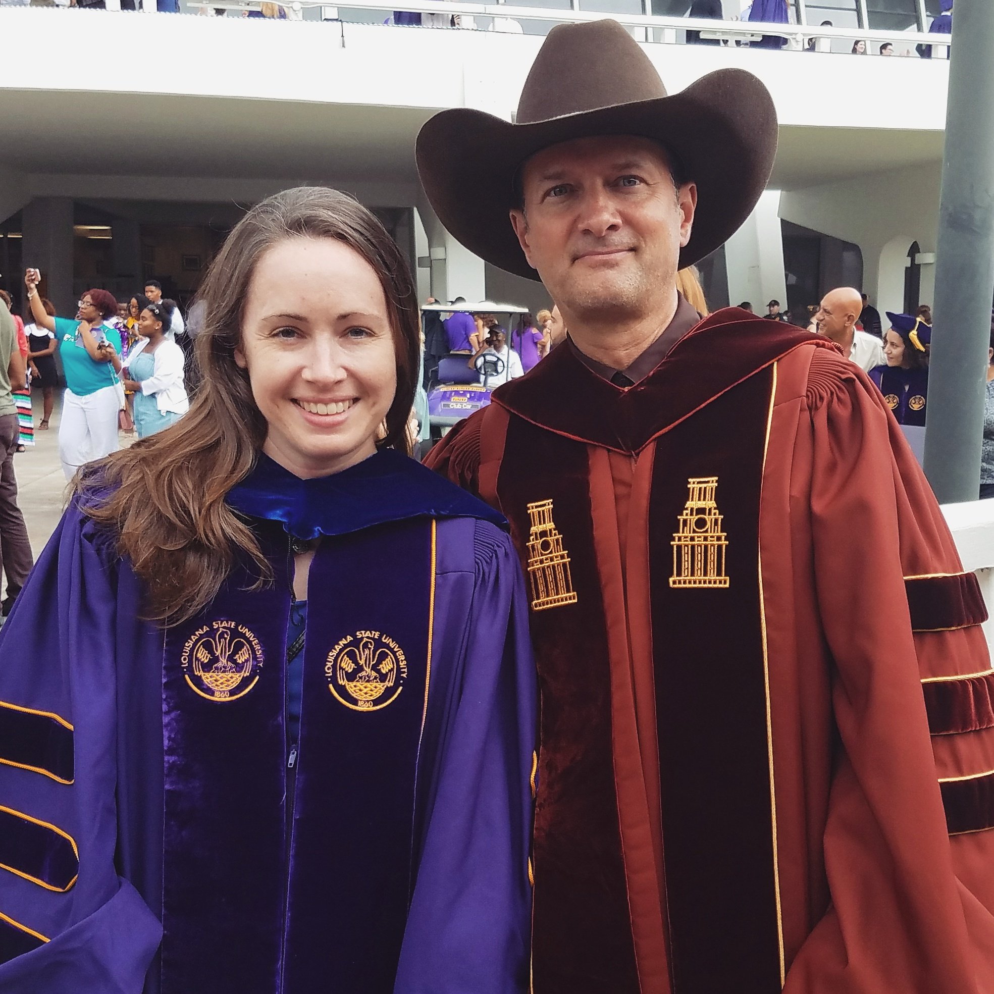 Cathy newman graduates next to Dr. Chris Austin